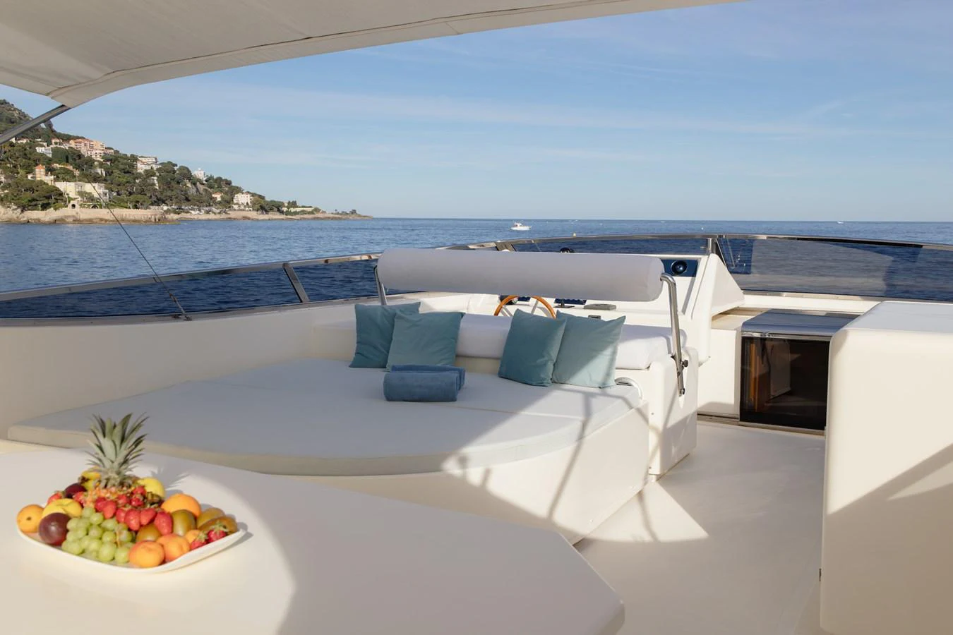 The sundeck offers a luxurious lounging area with plush cushions and a stunning sea view. aboard LADY MAUREEN Yacht for Sale