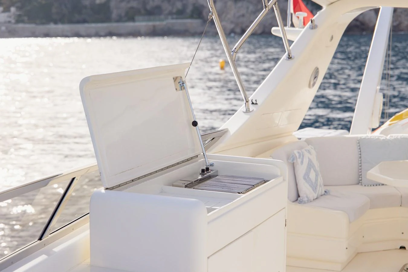 The yacht's deck features a built-in grill and comfortable seating area, perfect for outdoor dining and relaxation. aboard LADY MAUREEN Yacht for Sale