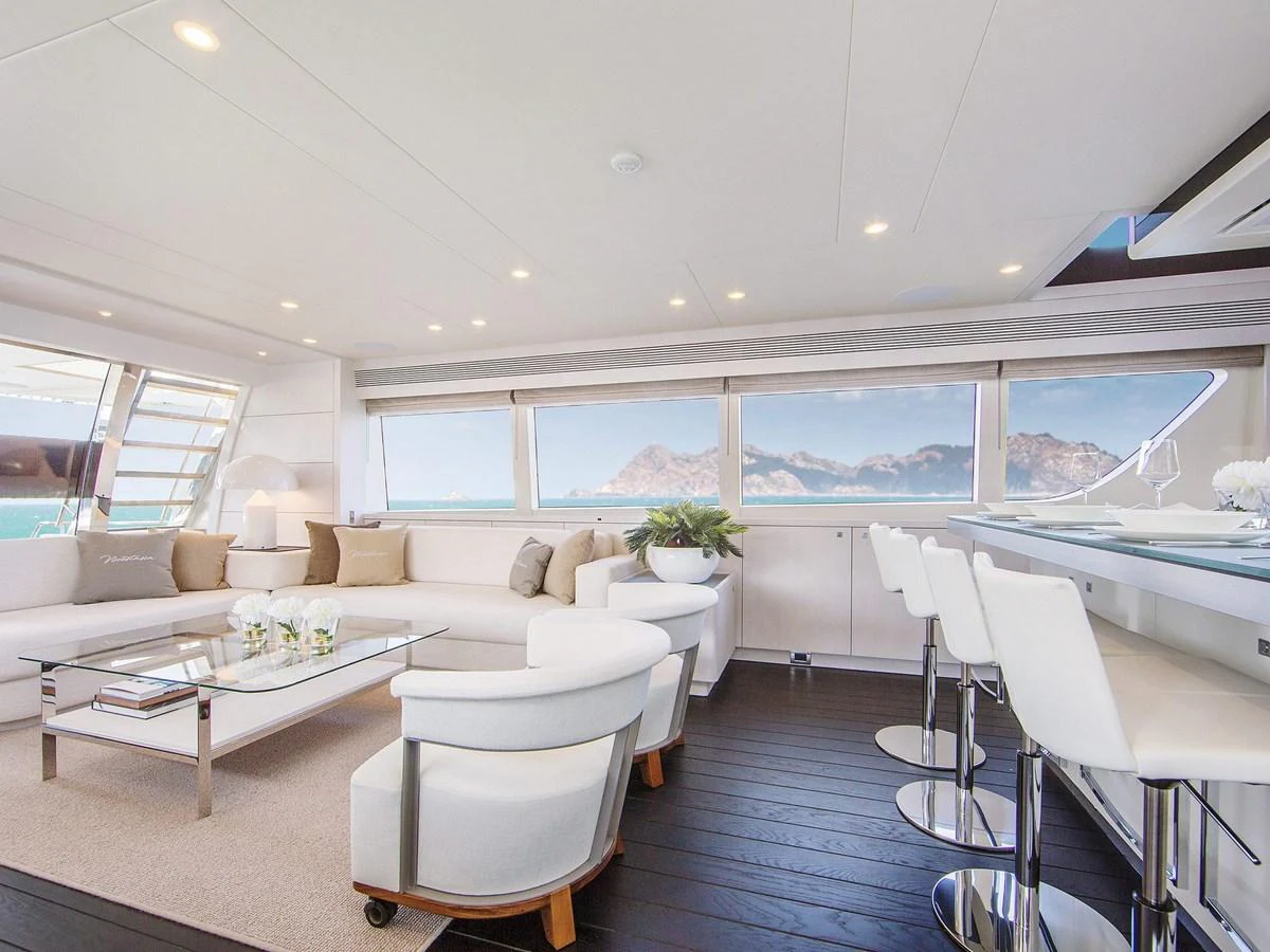The salon offers a spacious and elegant seating area with panoramic views. aboard NICOSTASIA Yacht for Sale