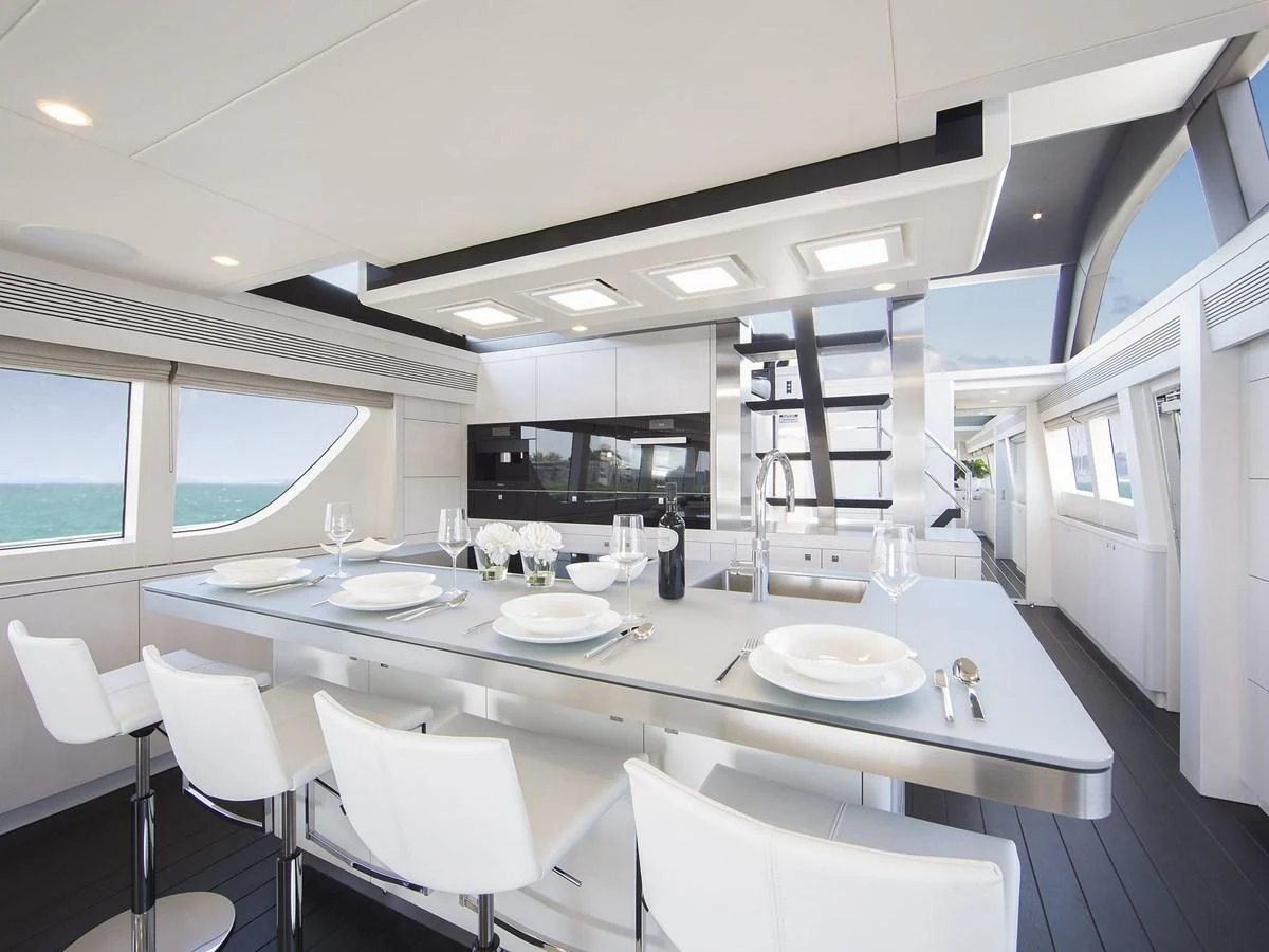 The sleek and modern galley features a spacious dining area with panoramic ocean views. aboard NICOSTASIA Yacht for Sale