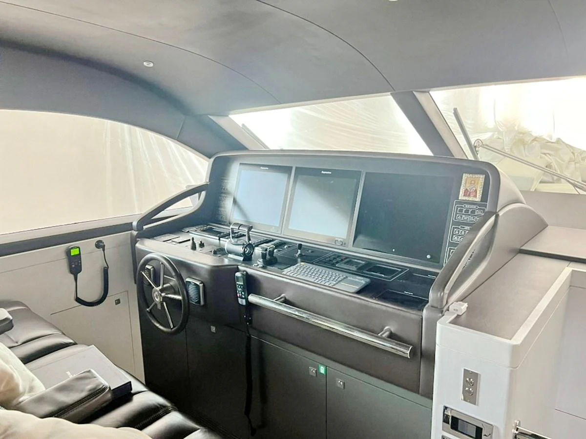 The helm station features advanced navigation equipment and a sleek, modern design. aboard NICOSTASIA Yacht for Sale