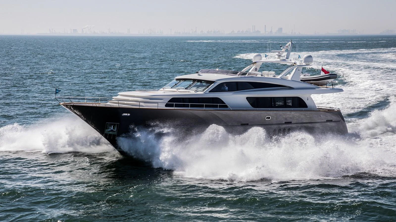 A sleek yacht cruises swiftly through the open water, showcasing its modern design and powerful performance. aboard NICOSTASIA Yacht for Sale