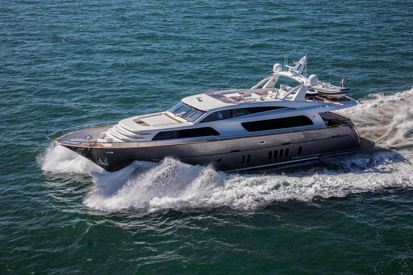 A sleek and modern yacht cruises swiftly through the open sea, showcasing its elegant design and powerful performance. aboard NICOSTASIA Yacht for Sale
