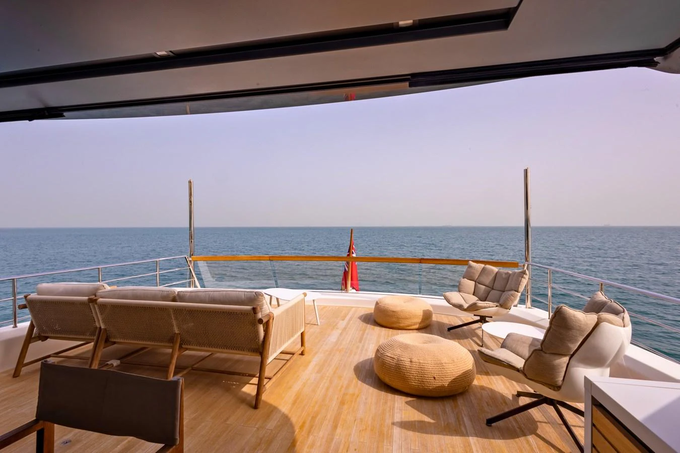 The aft deck offers a serene and spacious area for relaxation with stunning ocean views. aboard ILIA Yacht for Sale