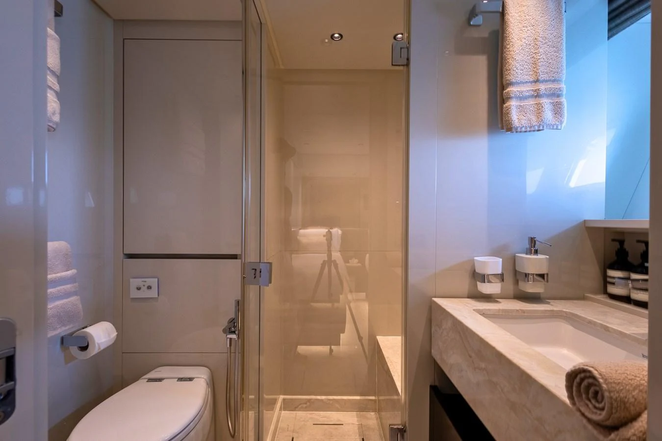 A luxurious yacht bathroom featuring modern fixtures and elegant design. aboard ILIA Yacht for Sale
