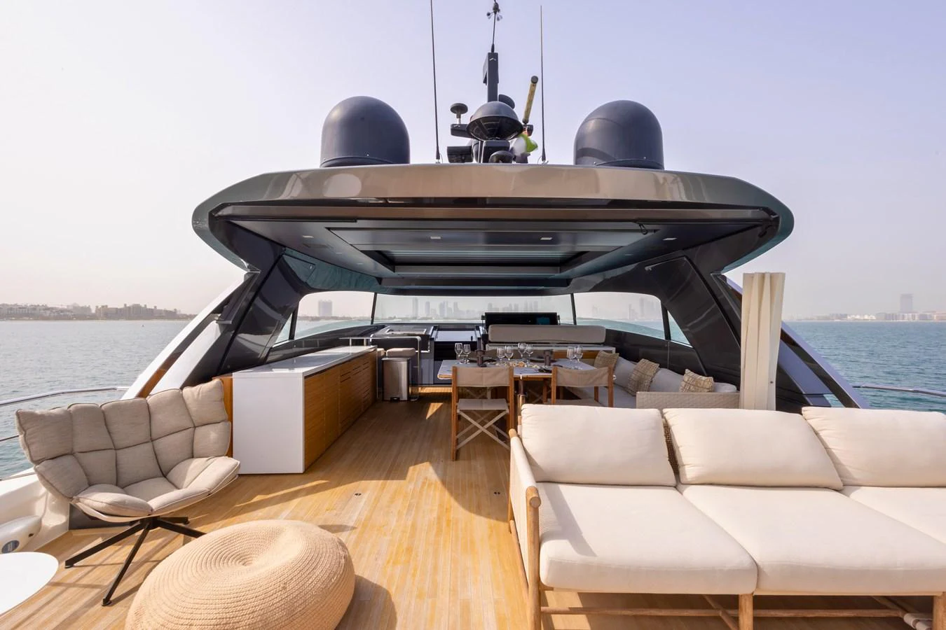 The aft deck offers a spacious and luxurious outdoor living area with comfortable seating and dining options. aboard ILIA Yacht for Sale