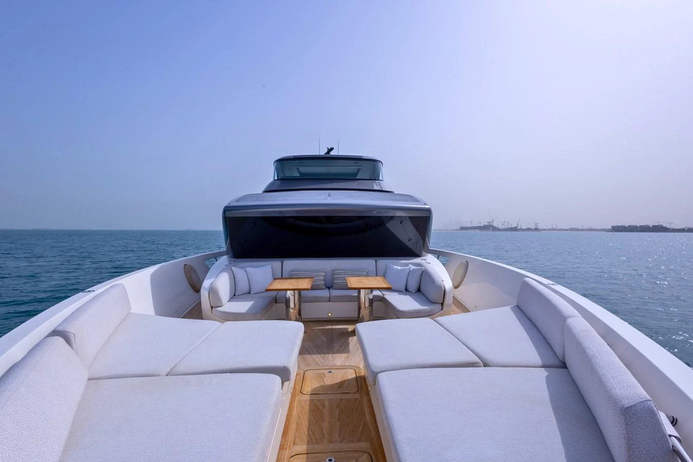The yacht's bow features luxurious sun loungers and a cozy seating area, perfect for relaxation. aboard ILIA Yacht for Sale