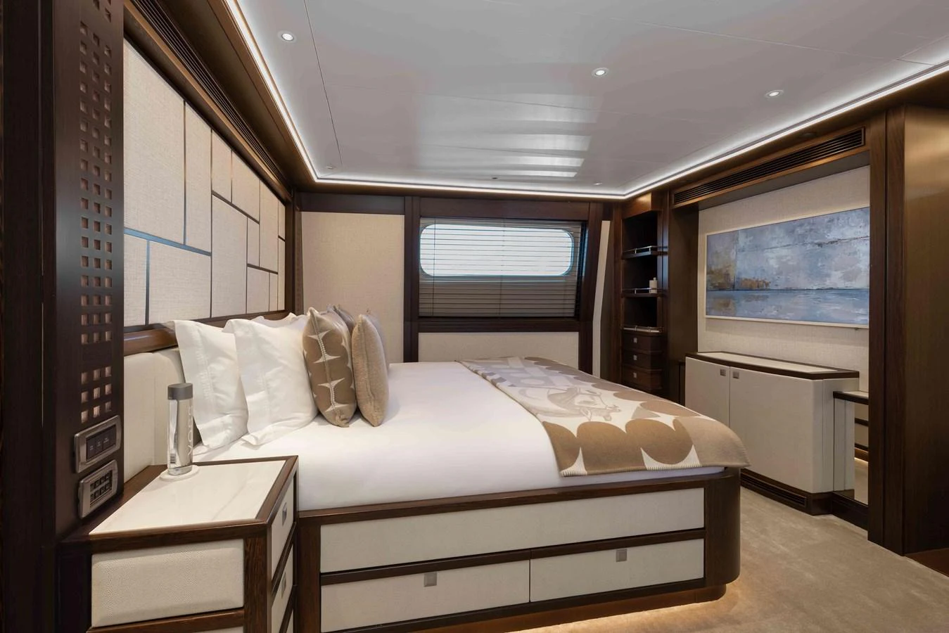 The master stateroom features a luxurious bed with elegant decor and ample natural light. aboard AURA Yacht for Sale
