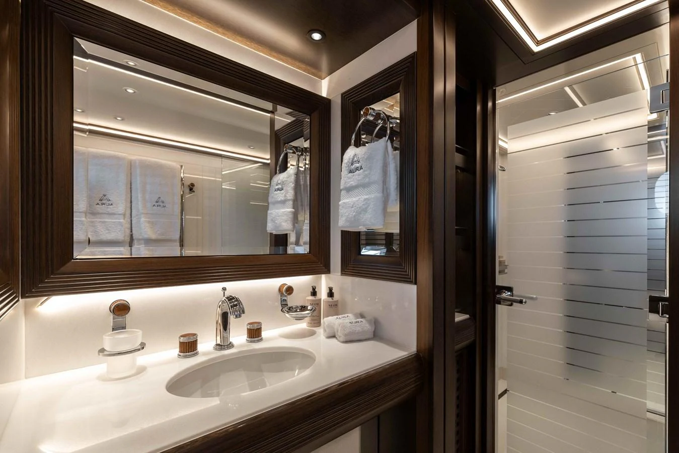 The yacht's bathroom features elegant fixtures and a modern design. aboard AURA Yacht for Sale