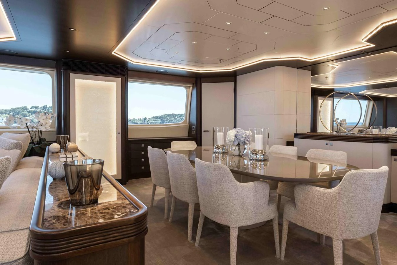 The yacht's dining area features elegant seating and a sophisticated ambiance. aboard AURA Yacht for Sale