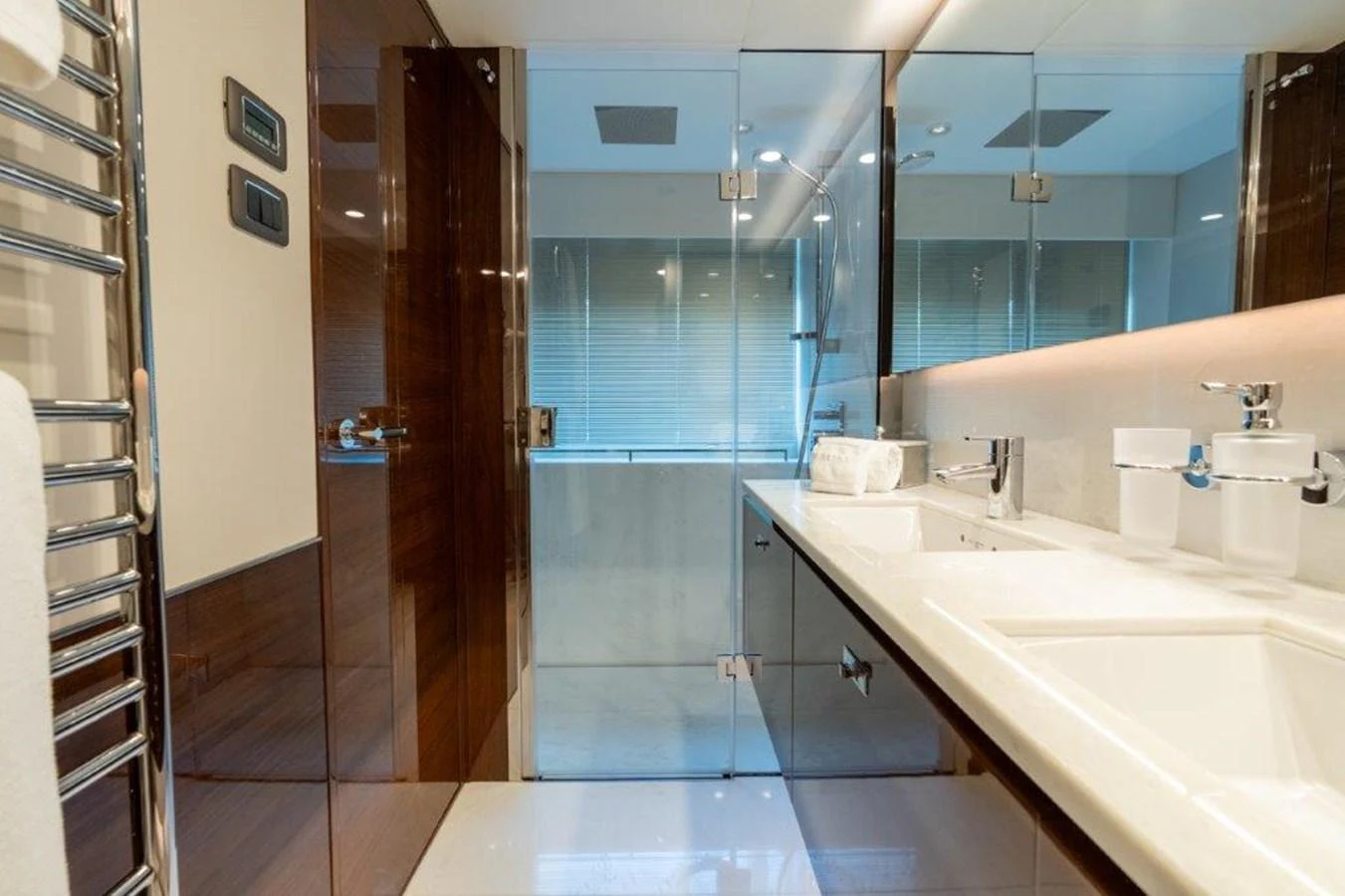 The yacht's bathroom features modern fixtures and a sleek design with ample lighting. aboard KAOS Yacht for Sale