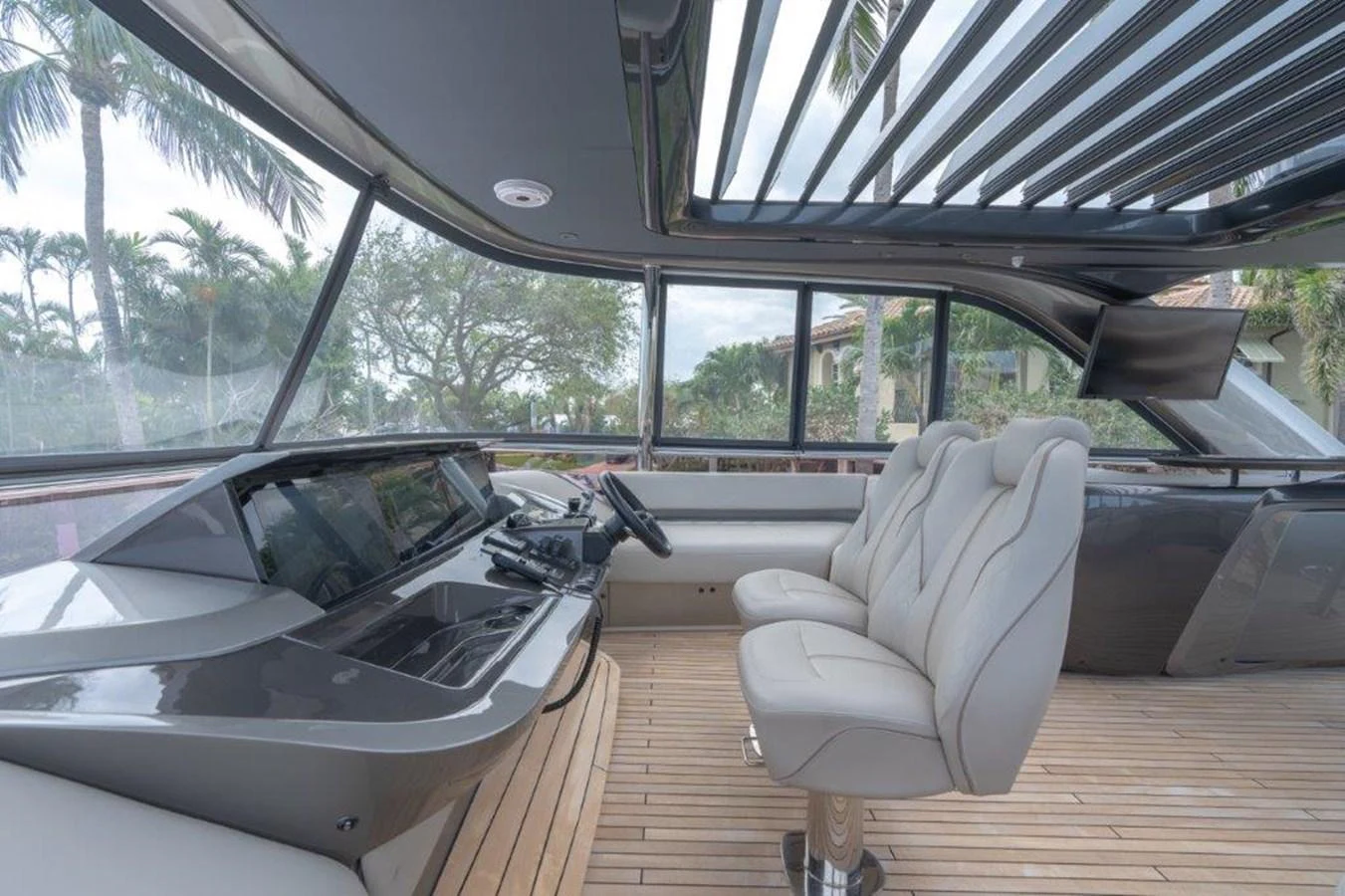 The helm area features modern controls and comfortable seating with panoramic views. aboard KAOS Yacht for Sale