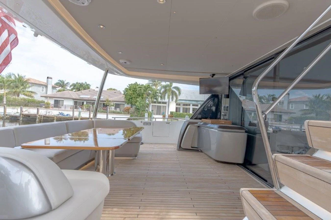 The aft deck offers a spacious and inviting area for relaxation and dining with a view of the surroundings. aboard KAOS Yacht for Sale