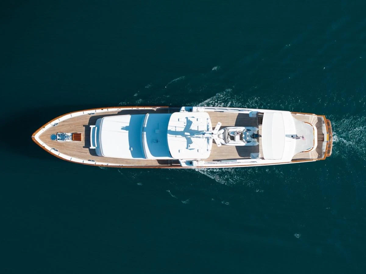 An aerial view of a luxurious yacht cruising through calm waters. aboard PASSAGE Yacht for Sale