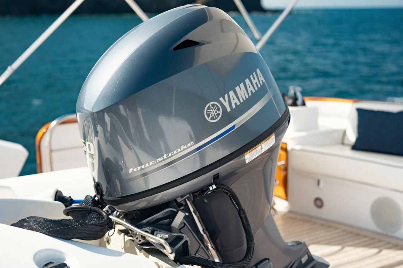 A close-up view of a powerful Yamaha outboard motor on the yacht's deck. aboard PASSAGE Yacht for Sale