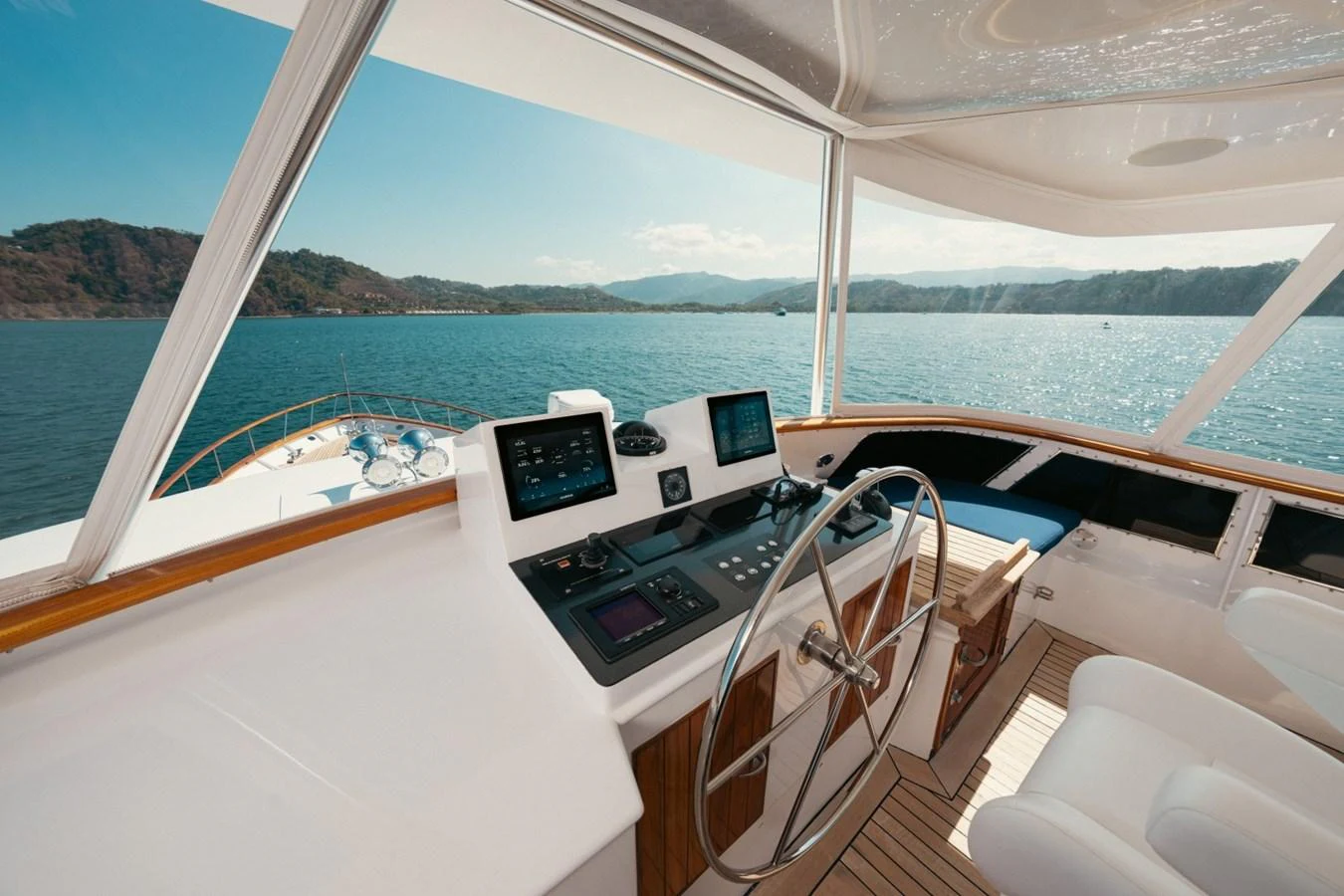 The helm station offers panoramic views and advanced navigation equipment. aboard PASSAGE Yacht for Sale