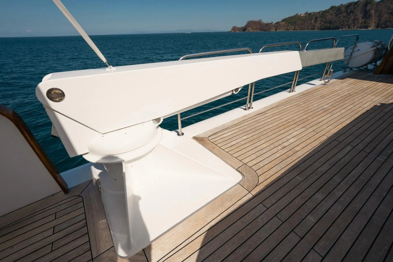 A close-up view of the yacht's deck featuring a sleek, modern davit crane. aboard PASSAGE Yacht for Sale