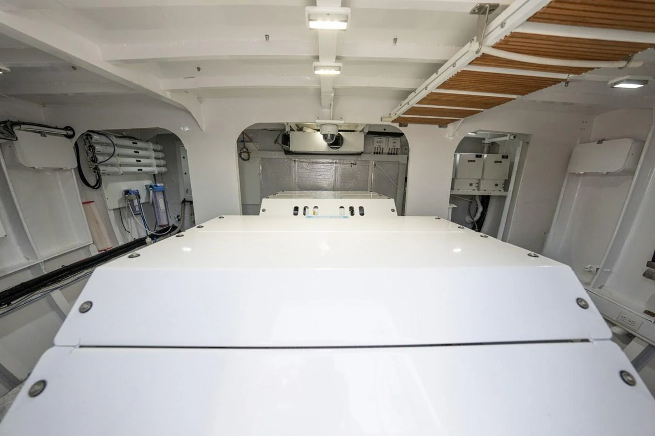 The image showcases the clean and well-organized engine room of the yacht. aboard PASSAGE Yacht for Sale