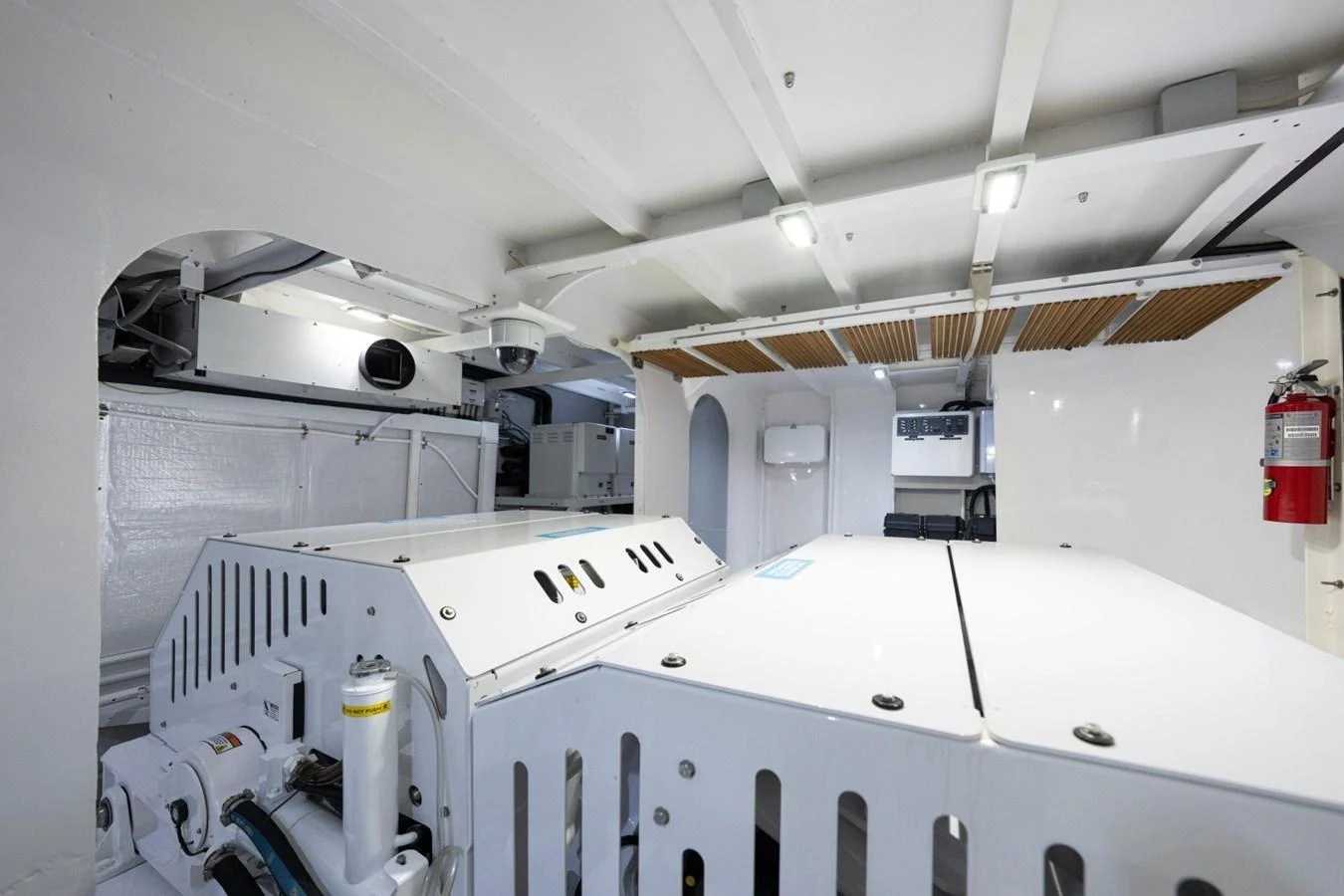 The image showcases the clean and well-organized engine room of the yacht. aboard PASSAGE Yacht for Sale