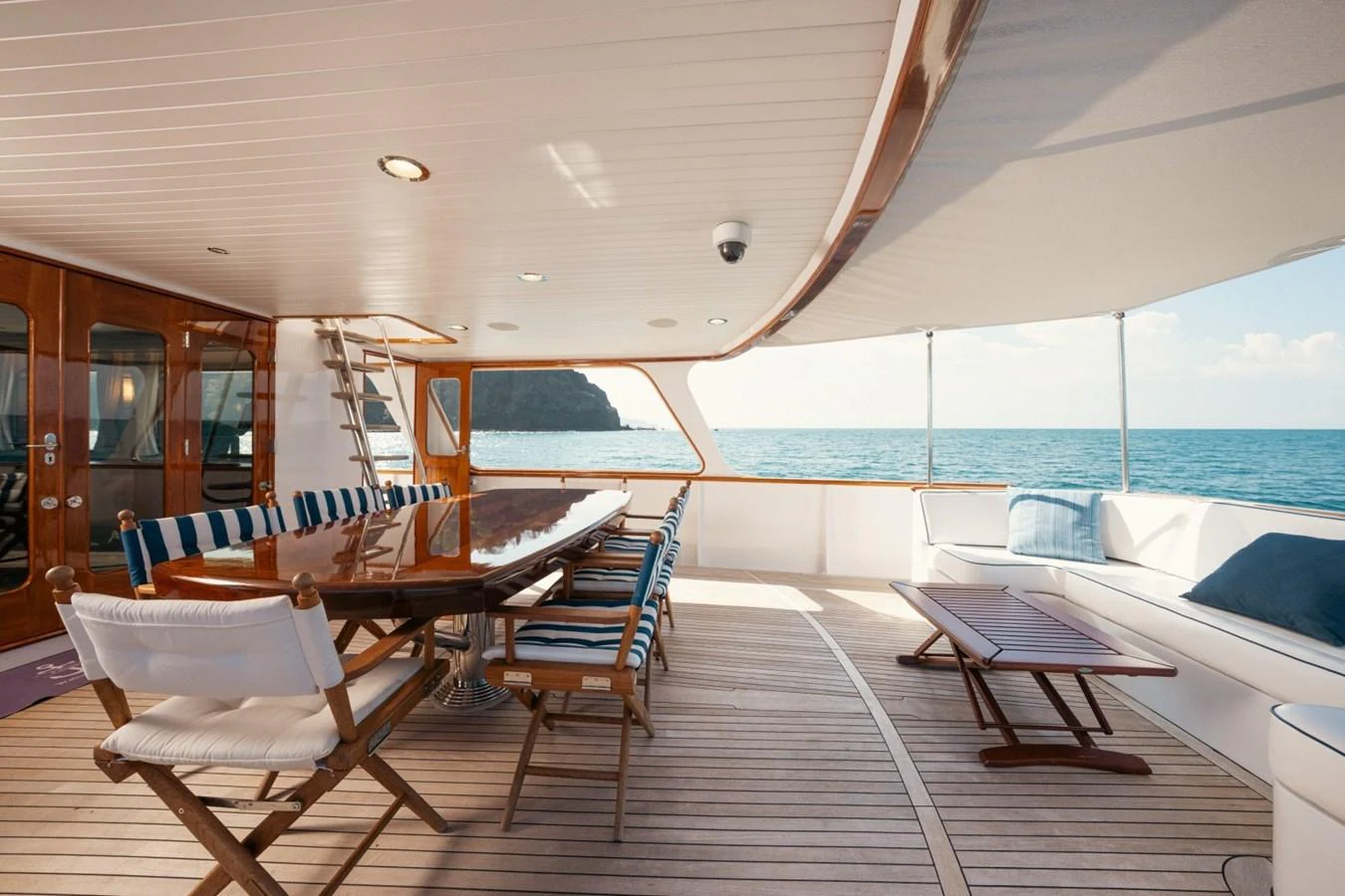 The aft deck offers a spacious and inviting area for alfresco dining and relaxation with stunning ocean views. aboard PASSAGE Yacht for Sale