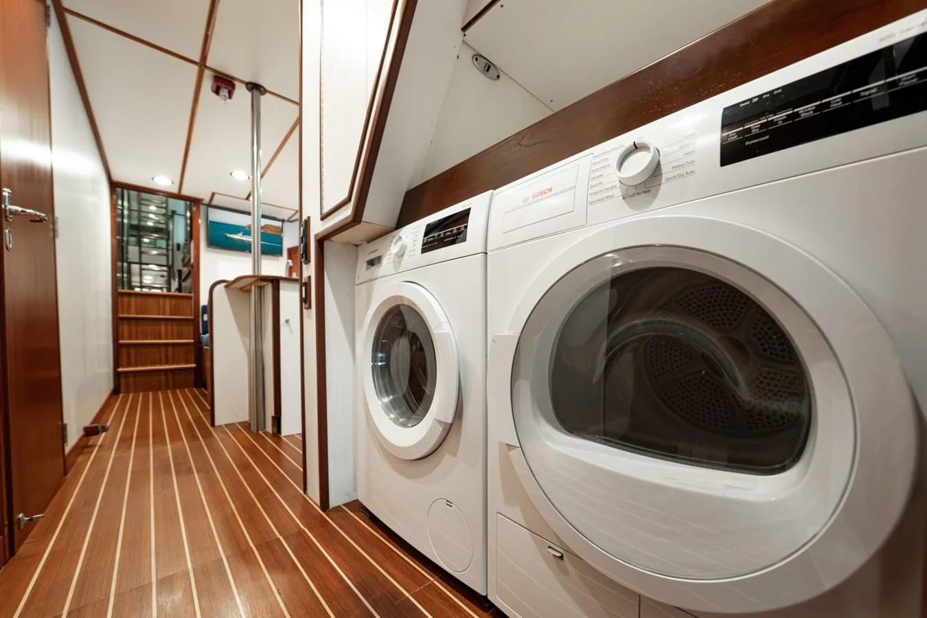 The yacht features a well-equipped laundry room with modern appliances and ample space. aboard PASSAGE Yacht for Sale