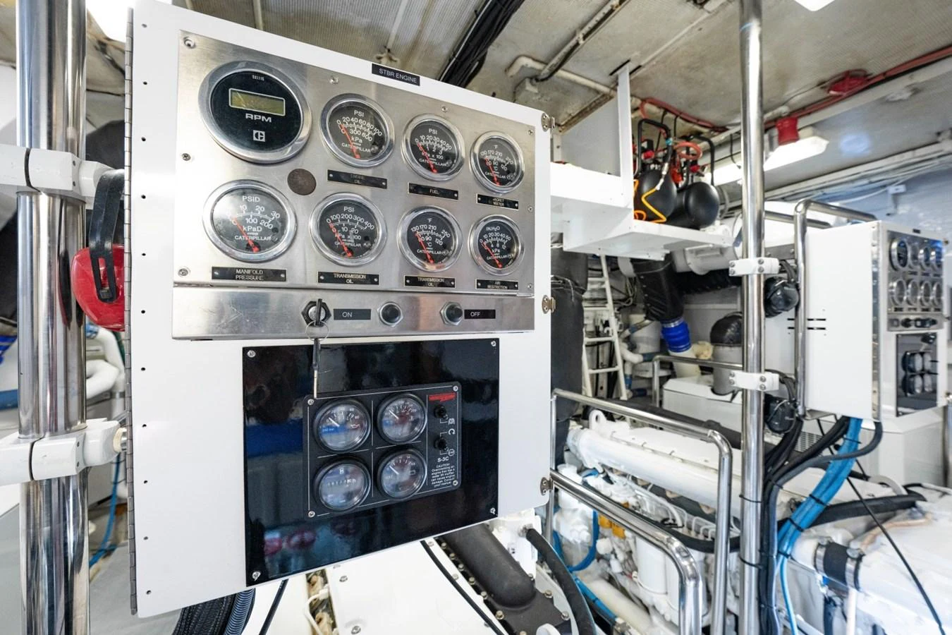 The image showcases the yacht's engine room with detailed control panels and machinery. aboard PASSAGE Yacht for Sale