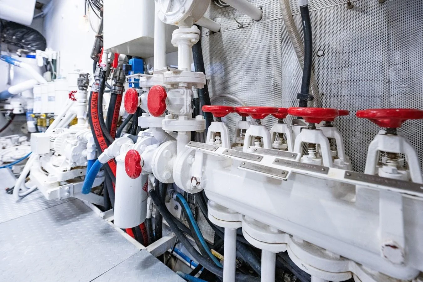 The image showcases the intricate mechanical systems and piping within the yacht's engine room. aboard PASSAGE Yacht for Sale
