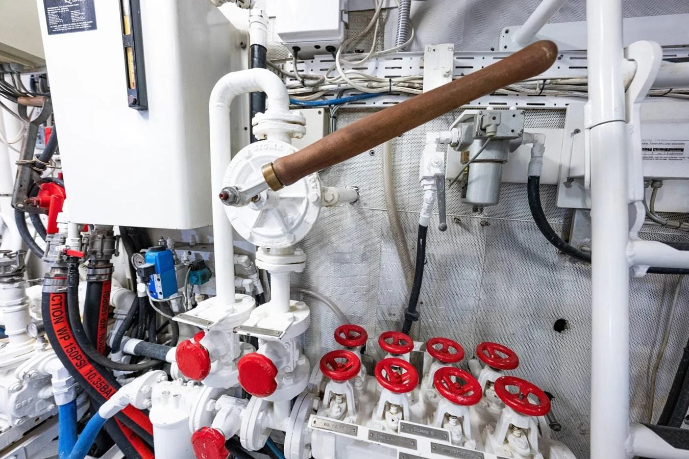 The image showcases the intricate and well-maintained engine room of the yacht, highlighting its technical components. aboard PASSAGE Yacht for Sale