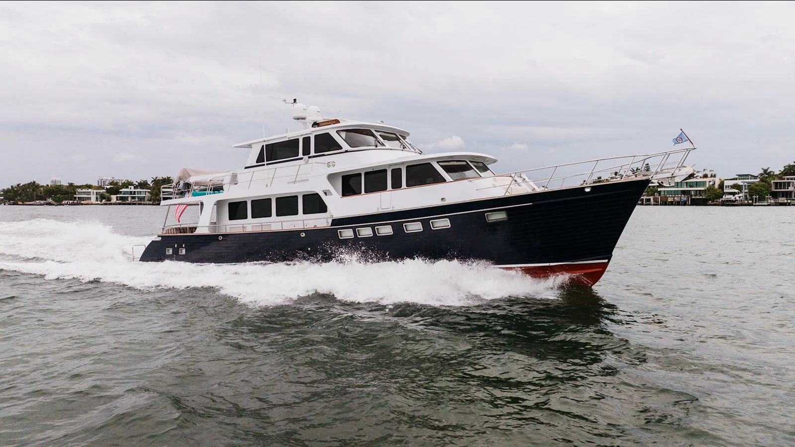 A sleek yacht cruises through the water, showcasing its elegant design and powerful performance. aboard TURANGALILA Yacht for Sale