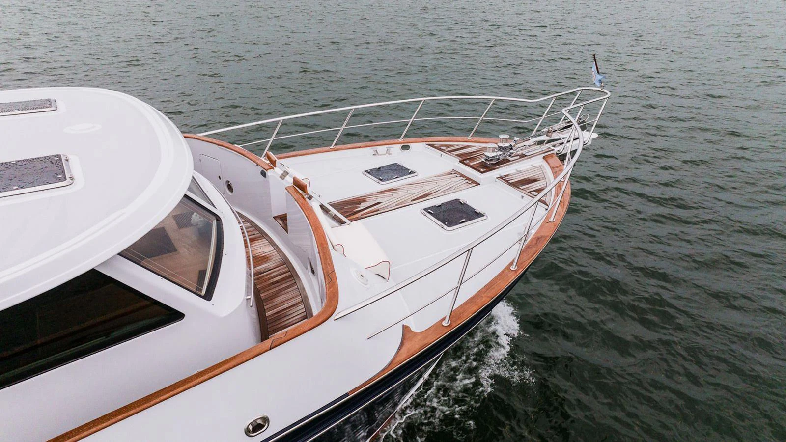 The sleek bow of the yacht cuts through the water effortlessly. aboard TURANGALILA Yacht for Sale