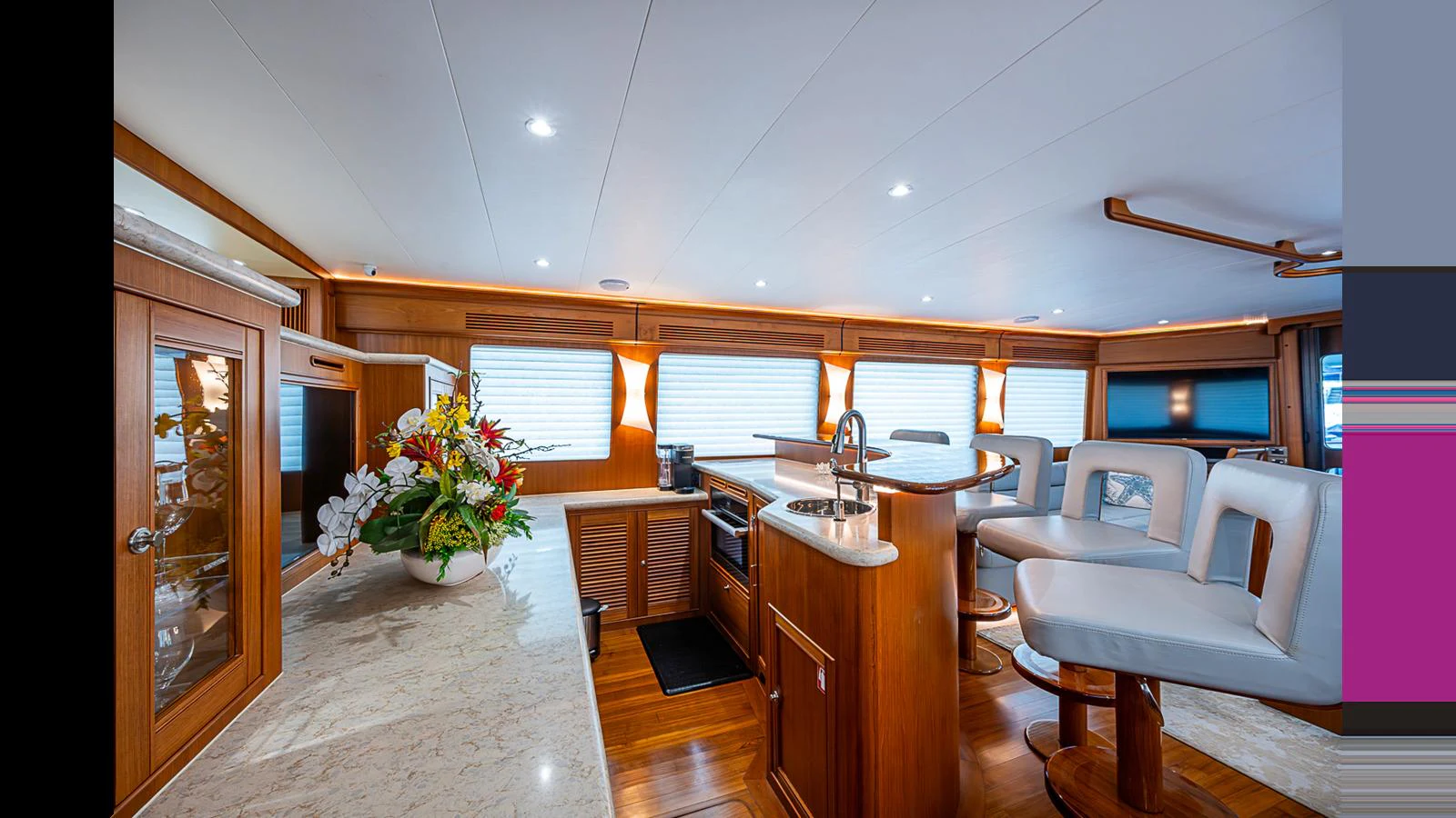 The yacht's galley features a spacious and elegant design with modern appliances and comfortable seating. aboard TURANGALILA Yacht for Sale