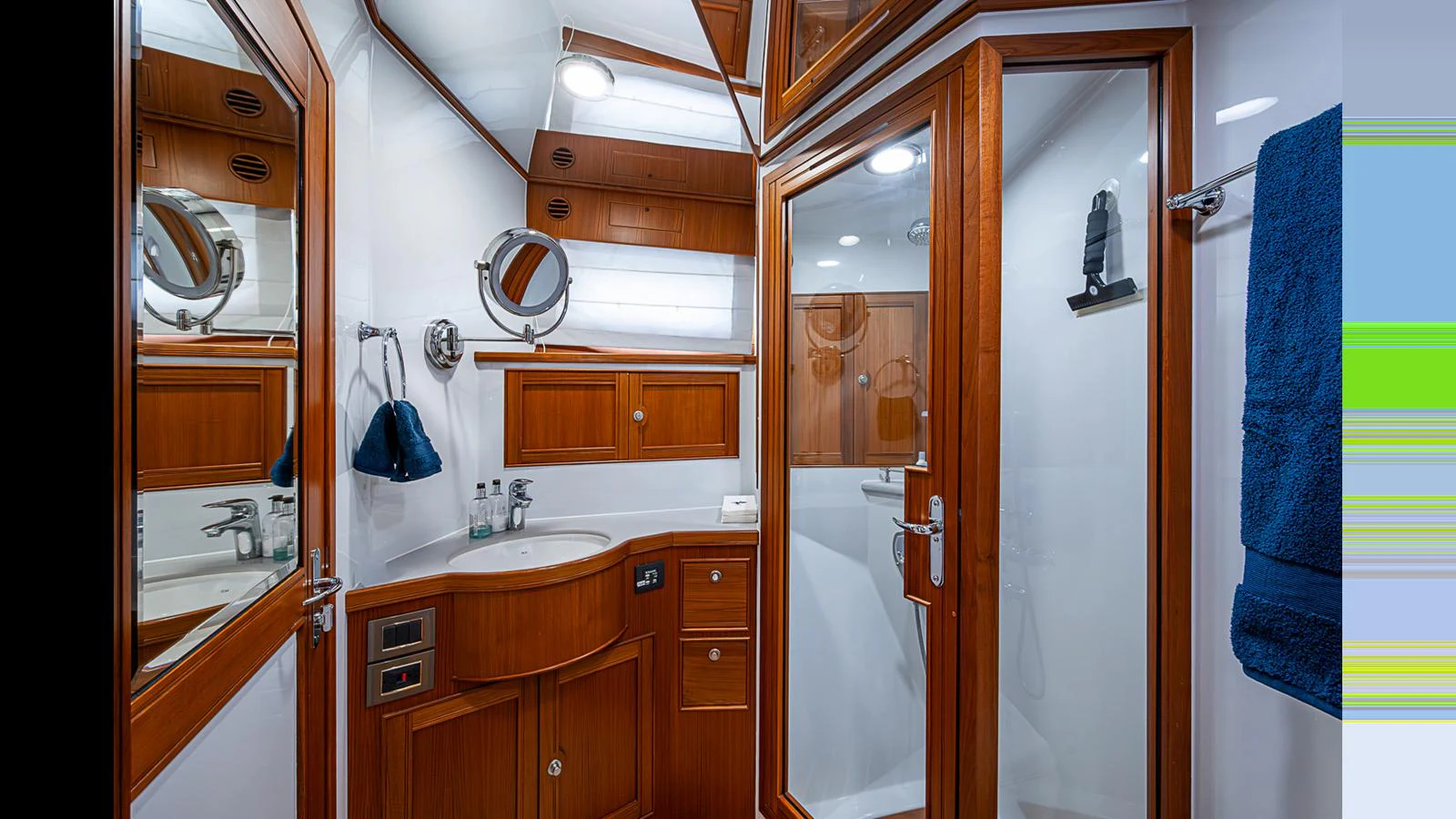 The yacht's bathroom features elegant wood finishes and modern fixtures. aboard TURANGALILA Yacht for Sale