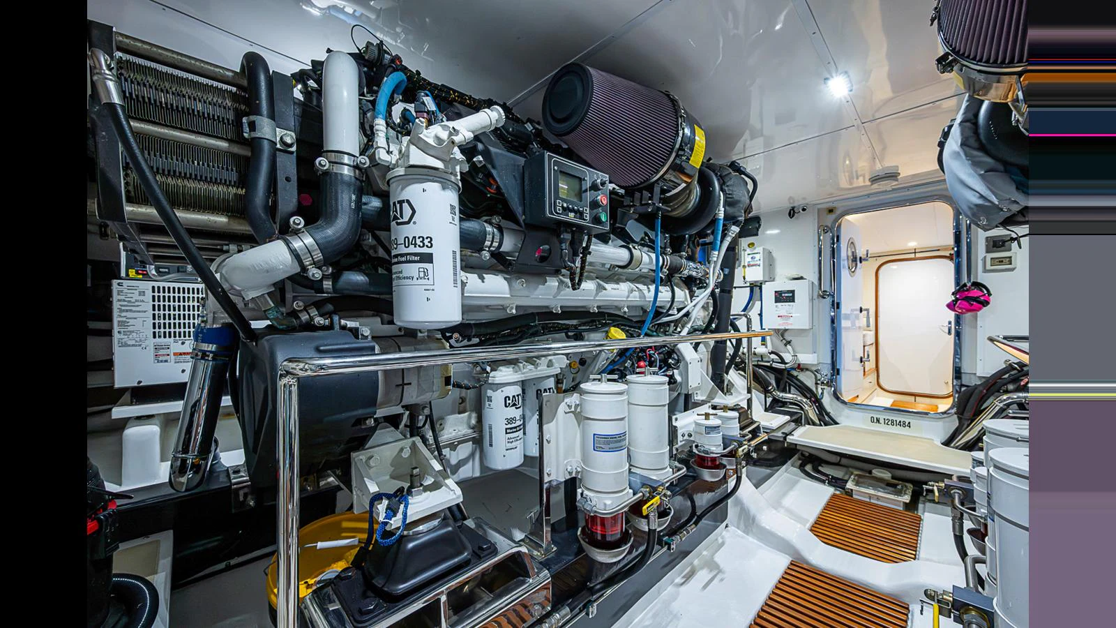 The image showcases a well-organized and meticulously maintained engine room with advanced machinery and equipment. aboard TURANGALILA Yacht for Sale