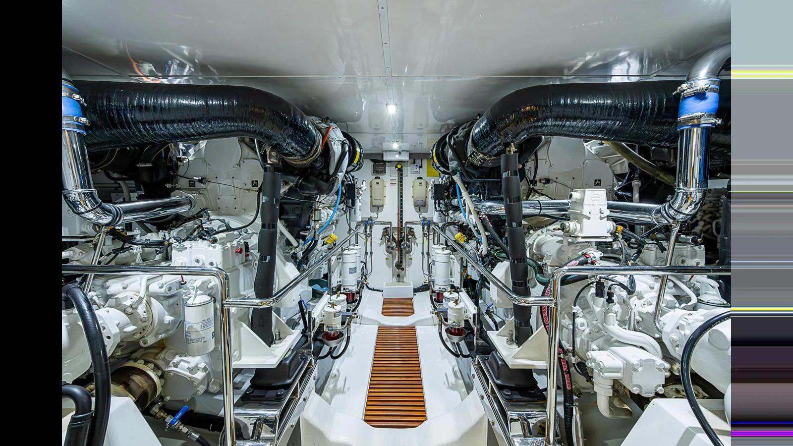 The yacht's engine room showcases a meticulously organized and high-tech mechanical space. aboard TURANGALILA Yacht for Sale