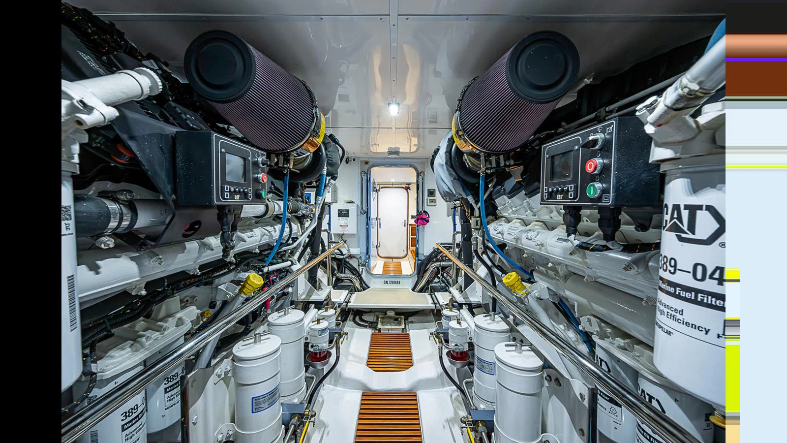 The yacht's engine room is meticulously organized, showcasing advanced machinery and systems. aboard TURANGALILA Yacht for Sale