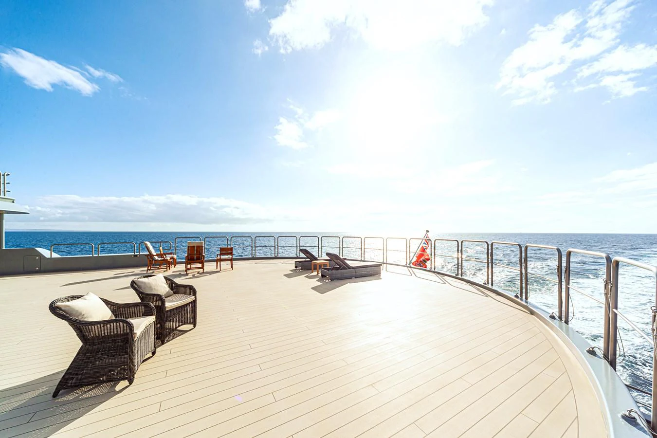 The spacious aft deck offers a serene setting with comfortable seating and stunning ocean views. aboard NURJA Yacht for Sale