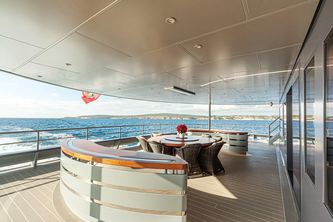 The aft deck offers a spacious and elegant area for alfresco dining and relaxation with stunning ocean views. aboard NURJA Yacht for Sale