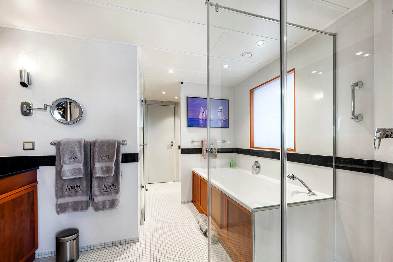 The yacht's bathroom features a spacious layout with modern fixtures and elegant finishes. aboard NURJA Yacht for Sale