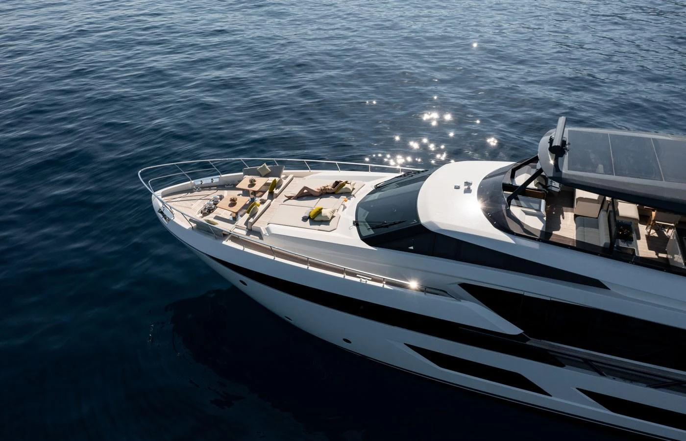 The yacht's sleek foredeck features luxurious sun loungers and a spacious layout, perfect for relaxation. aboard ALEGRIA II Yacht for Sale