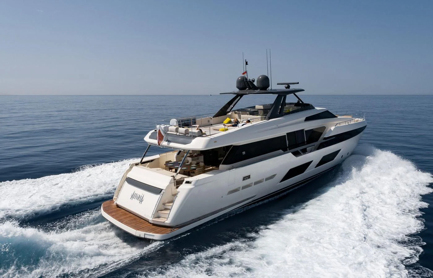 A sleek and modern yacht glides through the open water, showcasing its elegant design and spacious deck. aboard ALEGRIA II Yacht for Sale