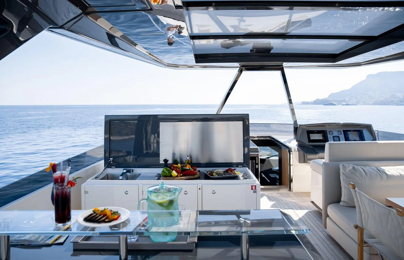 The flybridge offers a luxurious outdoor dining and lounging area with stunning sea views. aboard ALEGRIA II Yacht for Sale