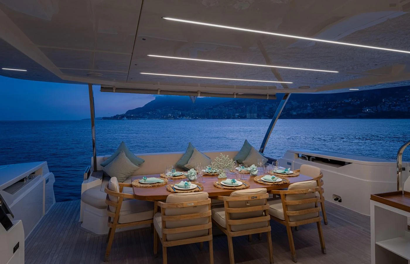 The aft deck features an elegant dining area with a stunning ocean view. aboard ALEGRIA II Yacht for Sale