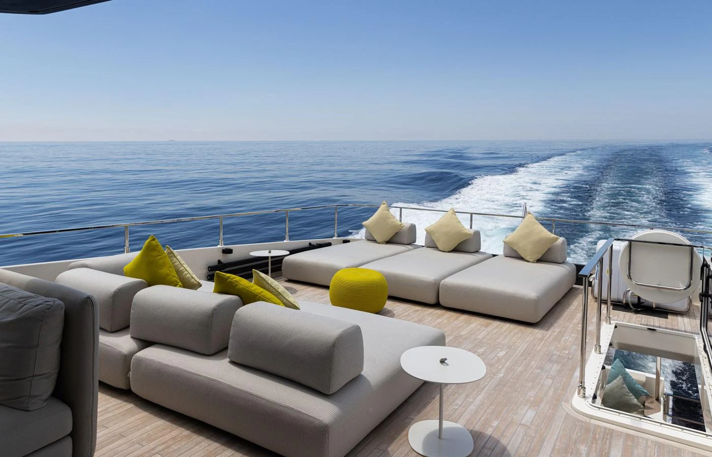 The aft deck offers a luxurious lounging area with plush seating and stunning ocean views. aboard ALEGRIA II Yacht for Sale