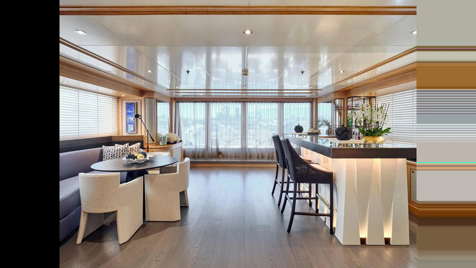 The salon offers a spacious and elegant area with modern furnishings and ample natural light. aboard THEOLINA Yacht for Sale