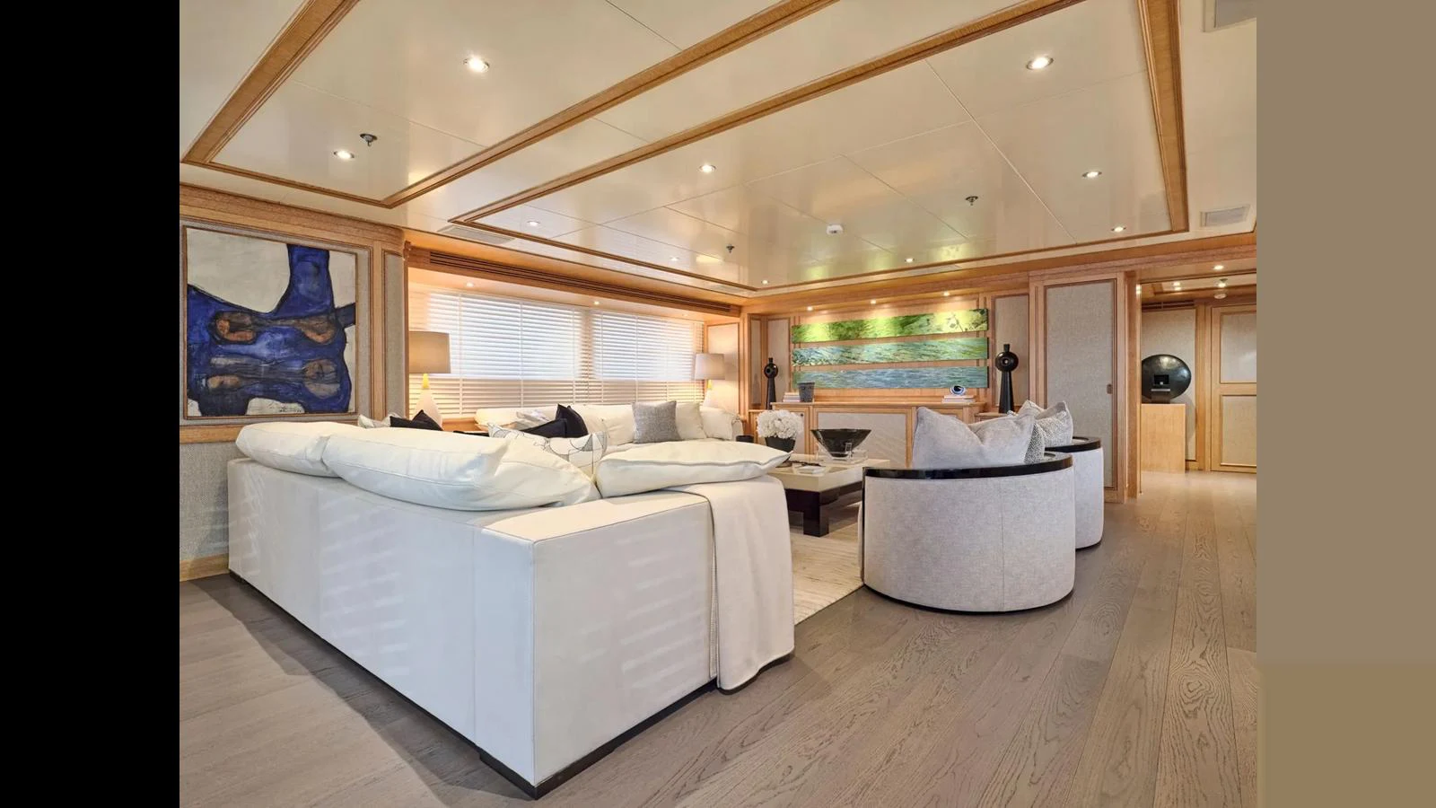 The spacious salon features elegant seating and tasteful decor, creating a luxurious and inviting atmosphere. aboard THEOLINA Yacht for Sale