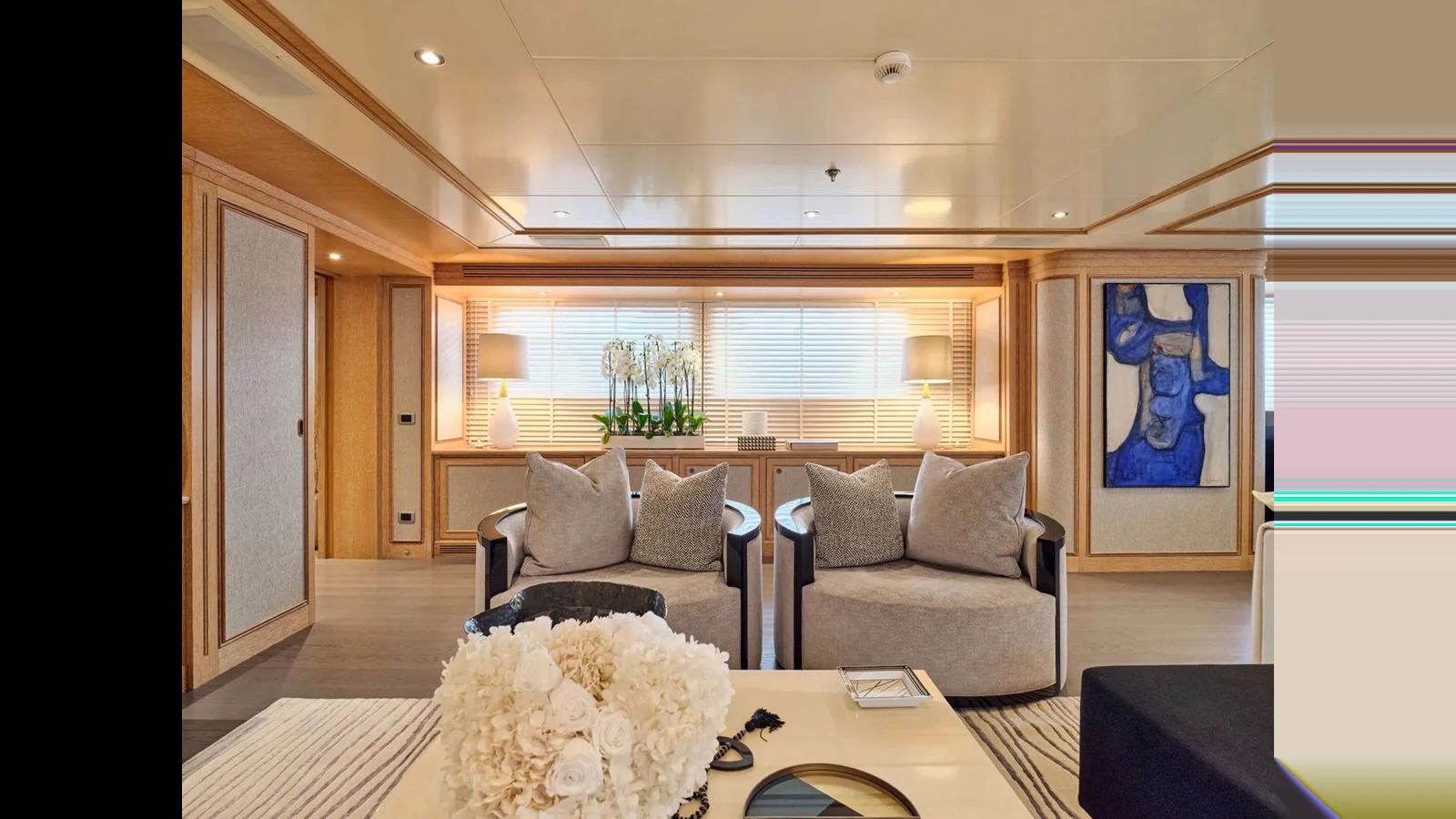 The yacht's interior features a luxurious and spacious living area with elegant decor and comfortable seating. aboard THEOLINA Yacht for Sale