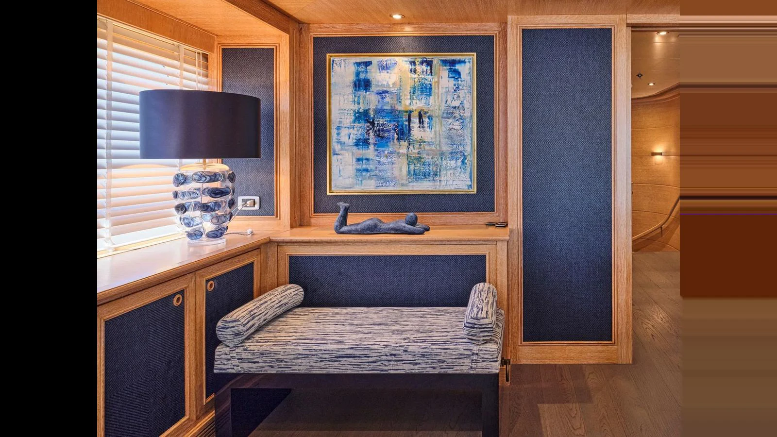 The yacht's interior features a stylish seating area with elegant decor and artwork. aboard THEOLINA Yacht for Sale