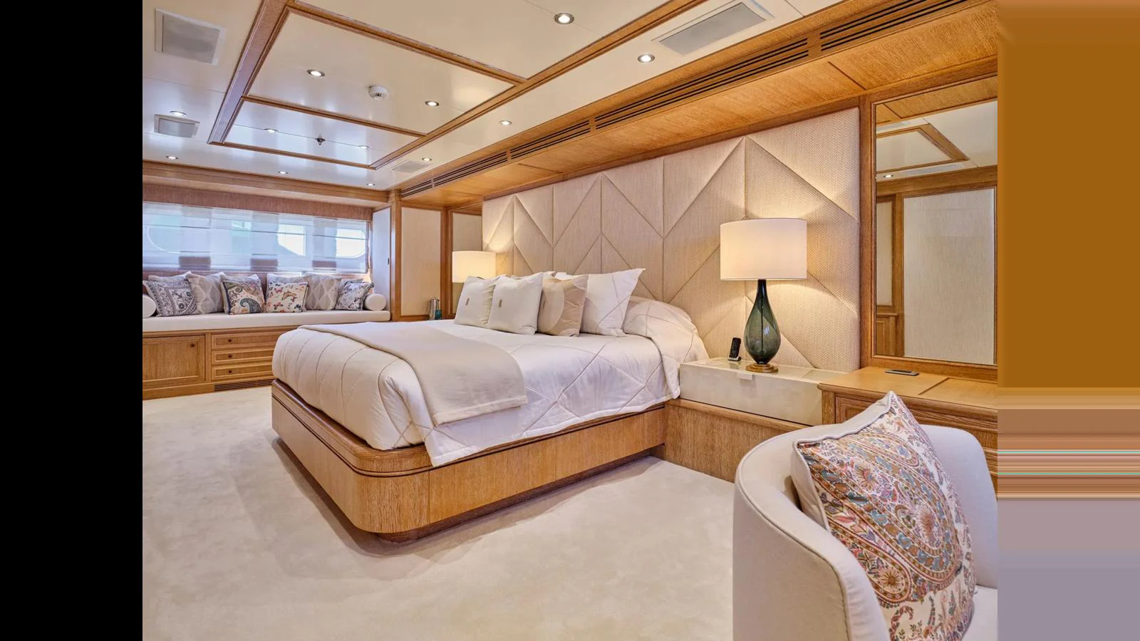 The master stateroom features a luxurious bed with elegant decor and ample natural light. aboard THEOLINA Yacht for Sale