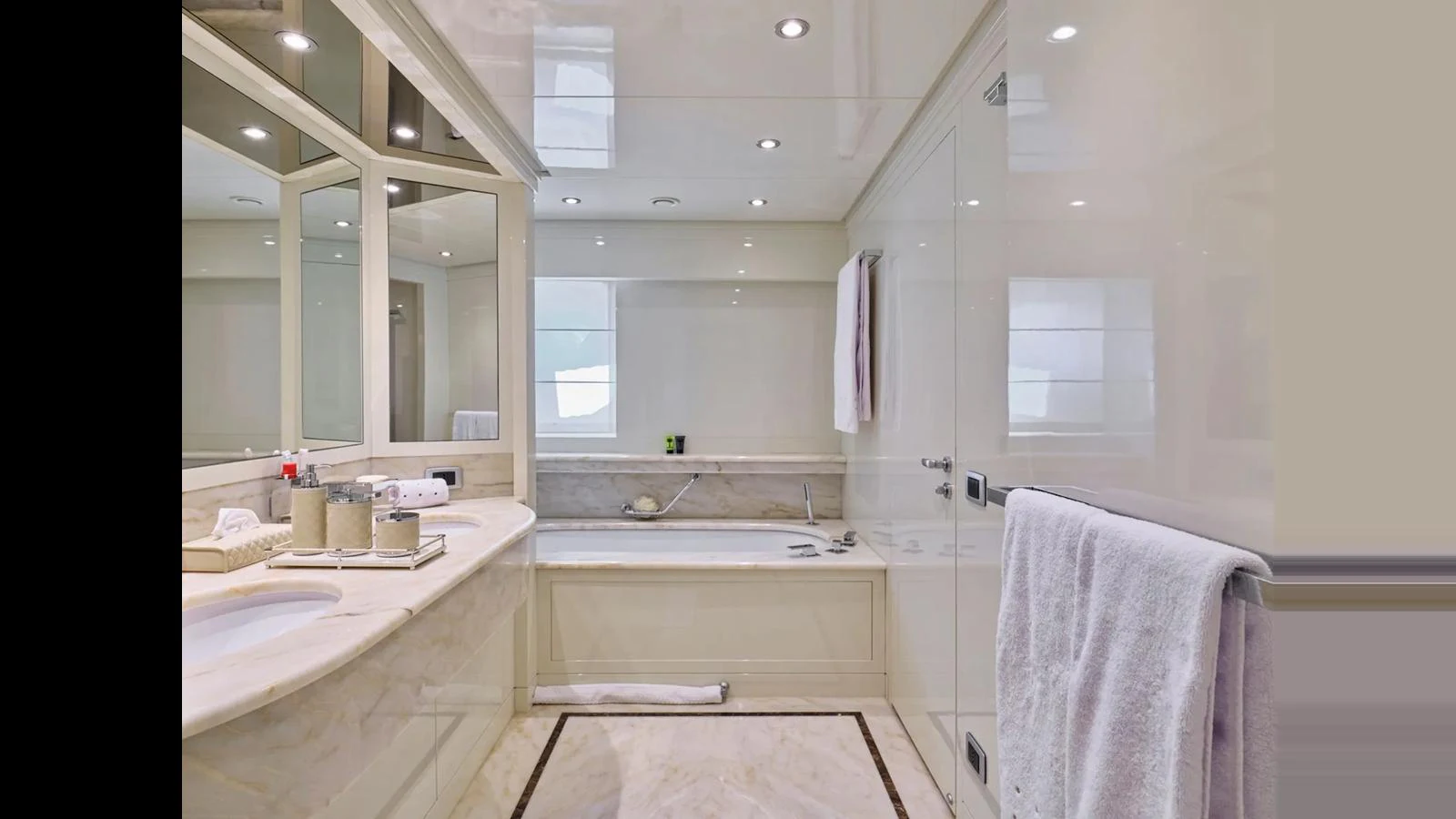 The yacht's bathroom features a luxurious design with a spacious bathtub and elegant fixtures. aboard THEOLINA Yacht for Sale