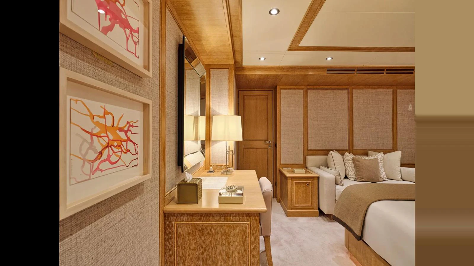 The yacht's interior features a cozy and elegantly designed living space with warm wooden accents and modern decor. aboard THEOLINA Yacht for Sale